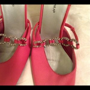 Pink cloth with rhinestone shoes.